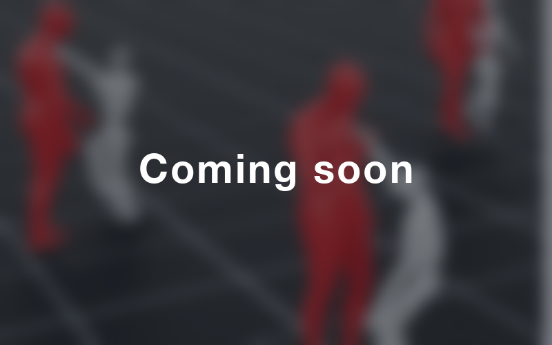 Blurred simulation view of humans interacting with a humanoid, overlaid with the text Coming soon